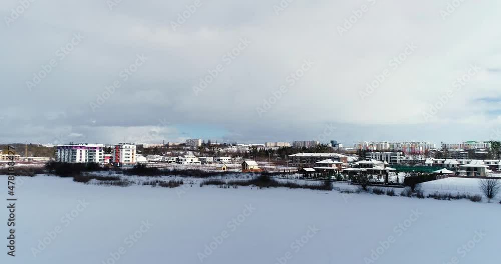 Top view of the winter village with snow covered houses and roads. Aerial view of landscape Top view of the winter village with snow covered houses and roads. Aerial view of landscape