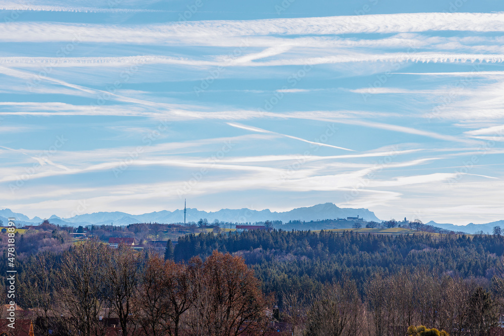 Transmission tower near Hohenpeissenberg in Bavaria against a slightly blurred backdrop of the Ammergau Alps in pastel colors Transmission tower near Hohenpeissenberg in Bavaria against a slightly blurred backdrop of the Ammergau Alps in pastel colors