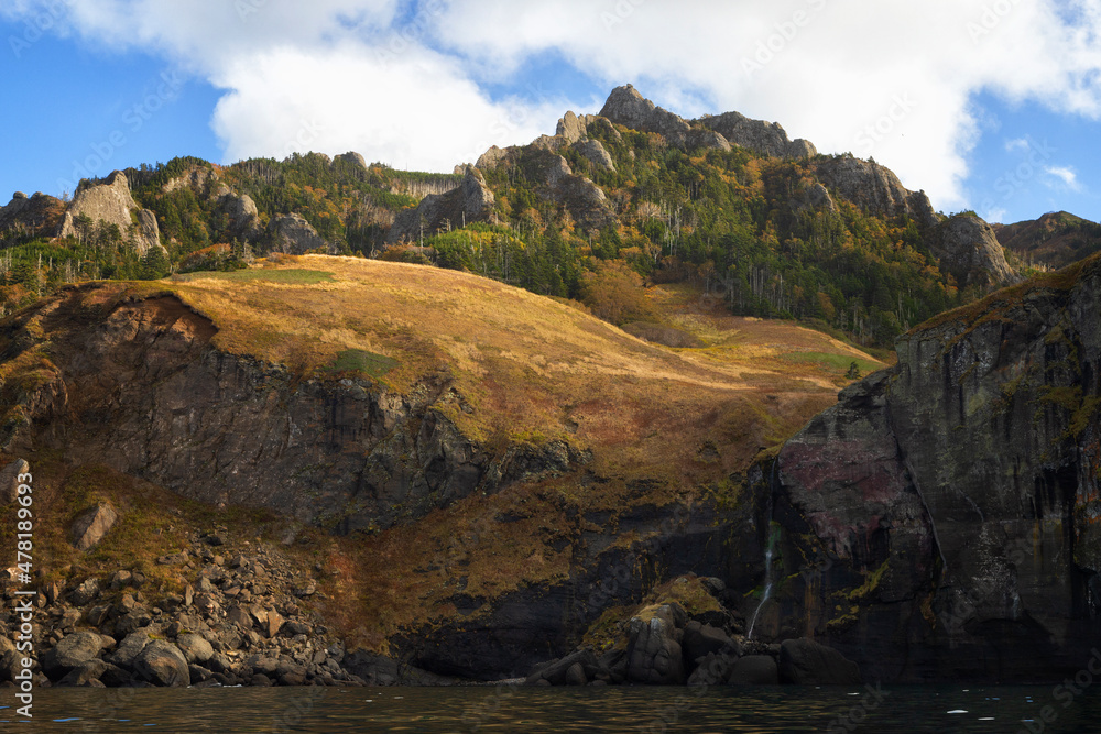 Waterfall on the rocks. Shore of Shikotan Island. Southern Kurils Waterfall on the rocks. Shore of Shikotan Island. Southern Kurils