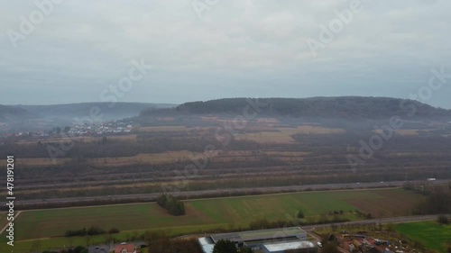 Aerial Rural Village Next To Hill