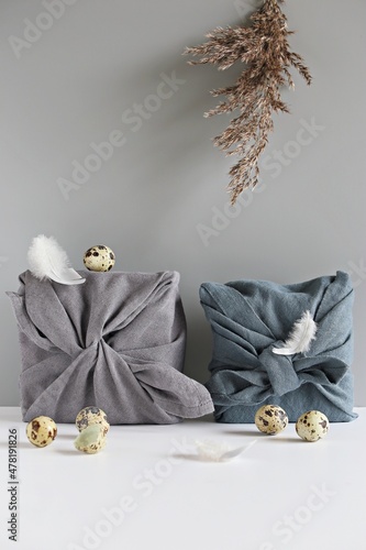 Easter eco-friendly gift wrapping in traditional Japanese Furoshiki style. Zero waste, environmental gift wrapping concept,