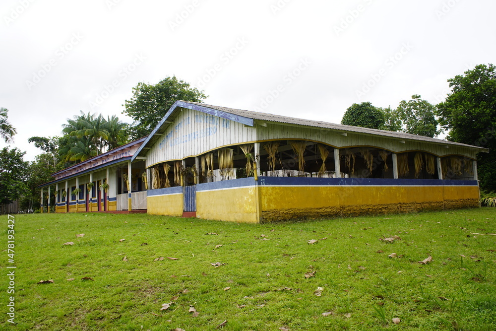 Fototapeta premium Indian secondary school, Alice dos Sanos on the Panema river bank (Portuguese: Esc. Municipal Indigena - Alice dos Santos. Amazozon Forest, Brazil.