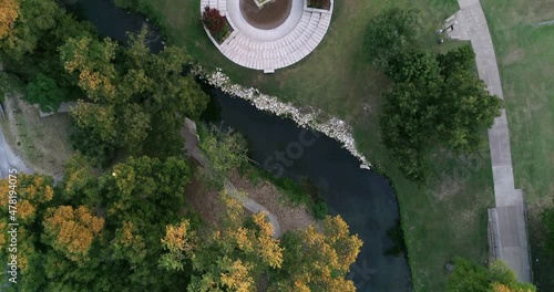 Drone flying over fountain in Granbury Texas. During the fall season. photo