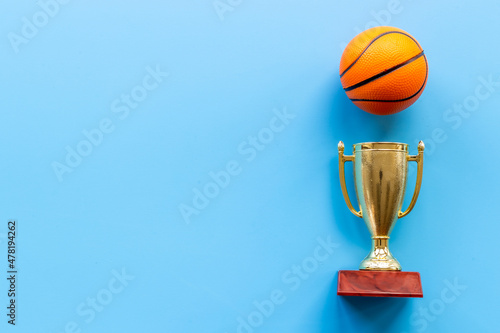 Golden trophy cup with sport game ball. Championship winner concept