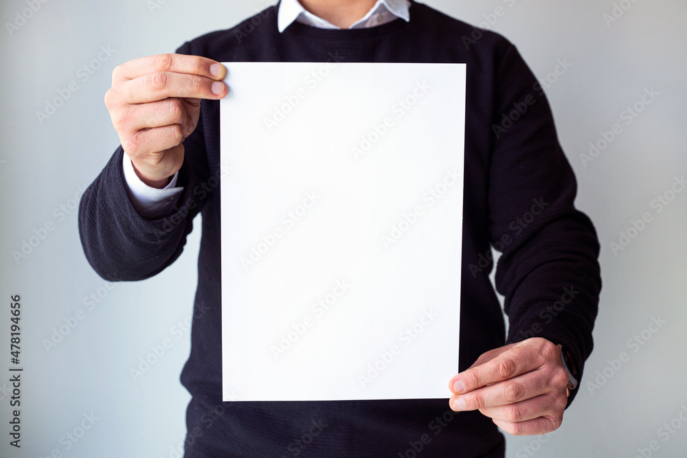 man holding blank white paper man holding blank white paper