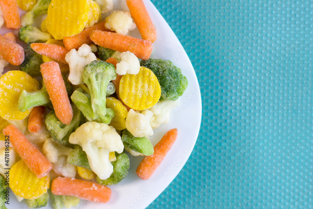 Frozen vegetable mixture on a white plate Frozen vegetable mixture on a white plate