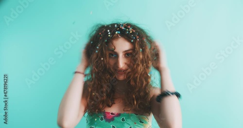 Girl covered in confetti. photo