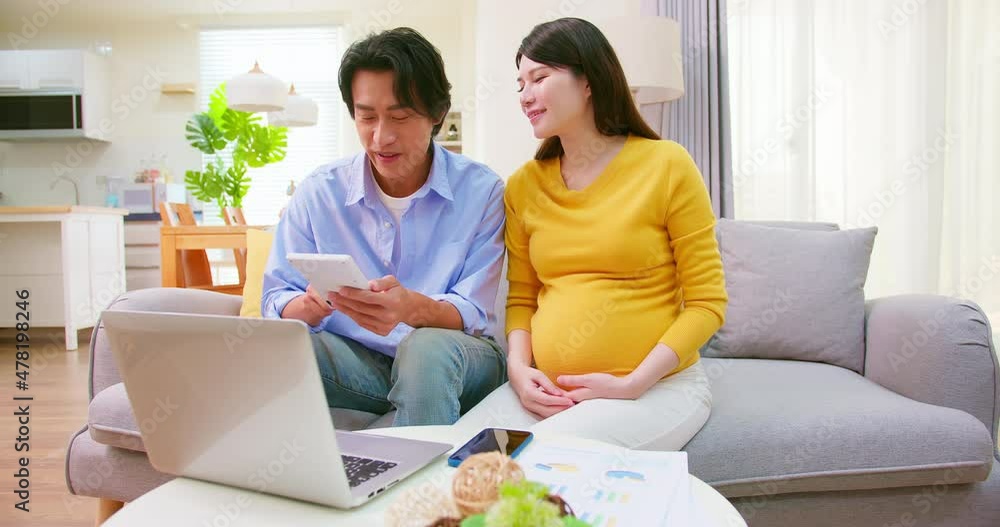 asian pregnant couple use computer asian pregnant couple use computer