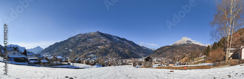Panoramic view on village and Valle di Primiero during sunny day and winter season