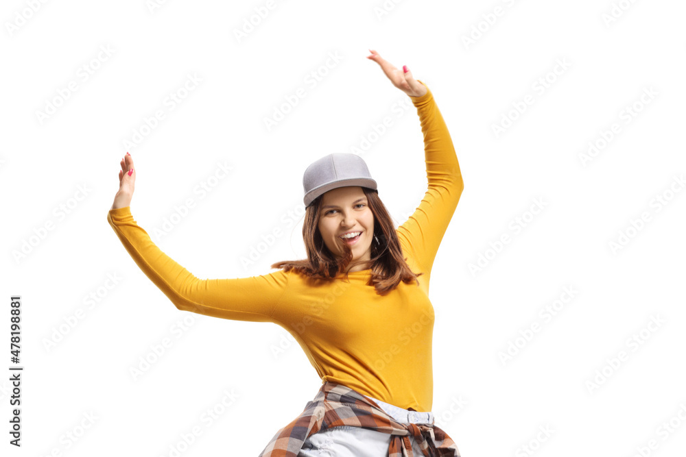 Young female dancing with raised arms