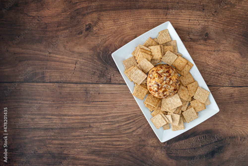Cheese Ball and Crackers on a Wooden Table
