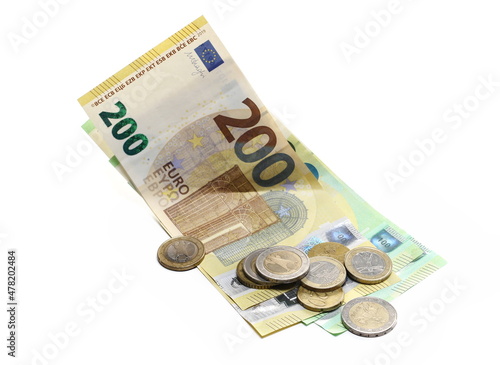 Two hundred euro banknotes, bills with change, cash paper money and coins isolated on white 