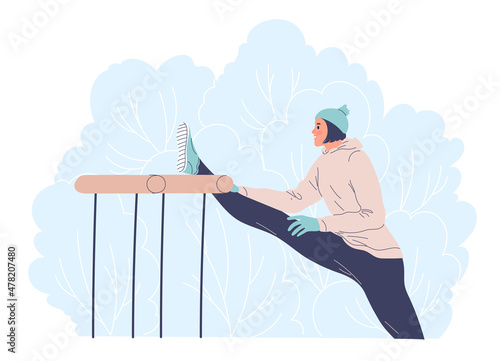 Woman working outdoors in the winter doing stretching.