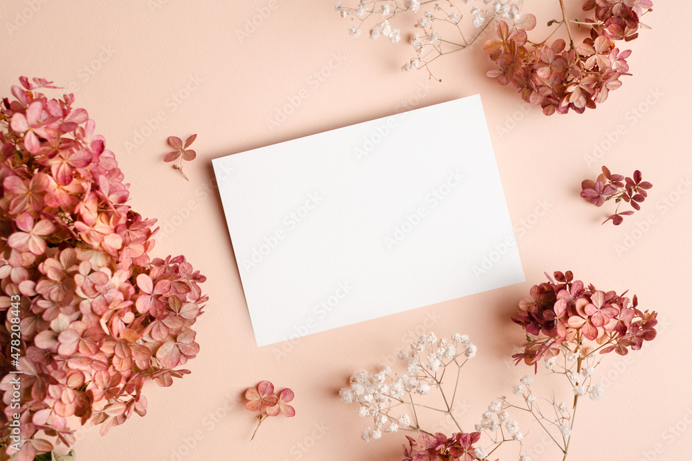 Invitation or greeting card mockup with hydrangea and gypsophila flowers decorations
