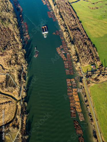 Fototapeta Stock Aerial Photo of Tug and Scow on the Fraser River, Canada