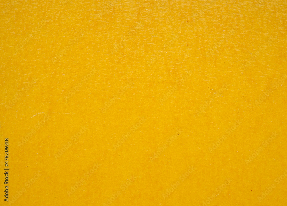 A dense industrial sheet of paper with a textured surface A dense industrial sheet of paper with a textured surface