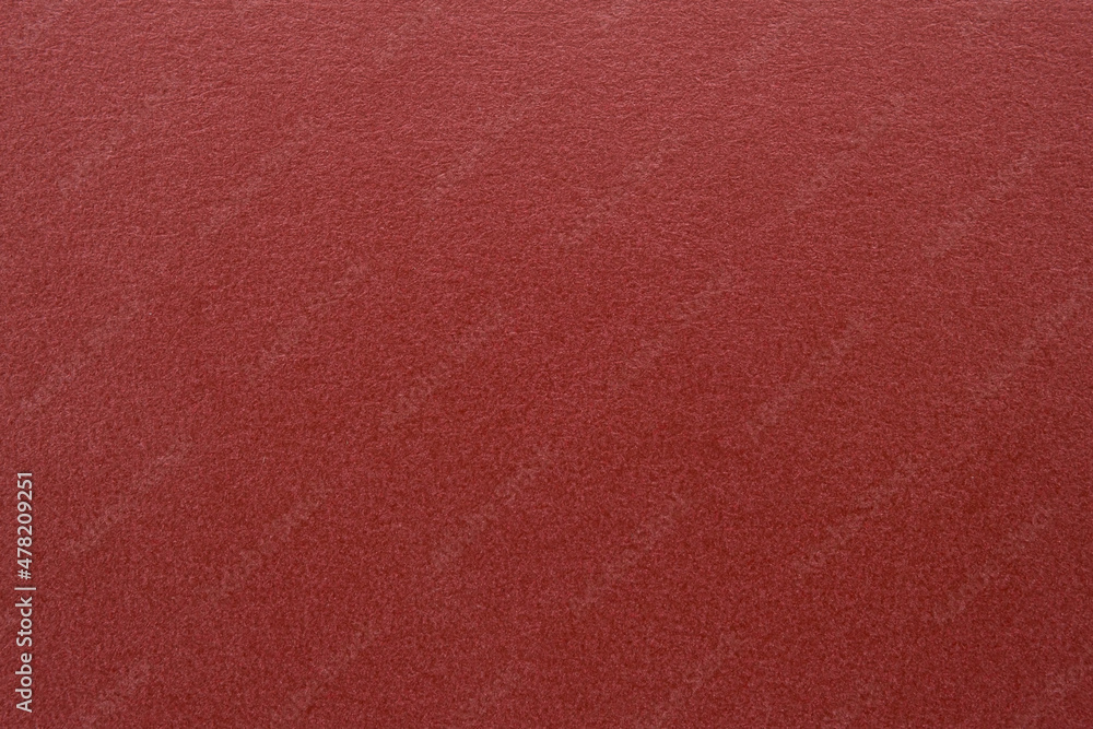 A dense industrial sheet of paper with a textured surface A dense industrial sheet of paper with a textured surface