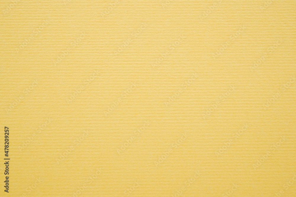 A dense industrial sheet of paper with a textured surface A dense industrial sheet of paper with a textured surface