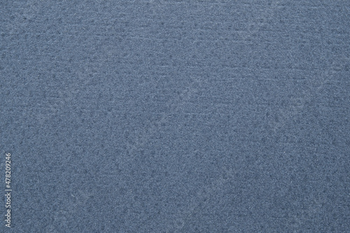 A dense industrial sheet of paper with a textured surface