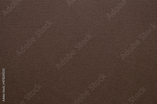 A dense industrial sheet of paper with a textured surface