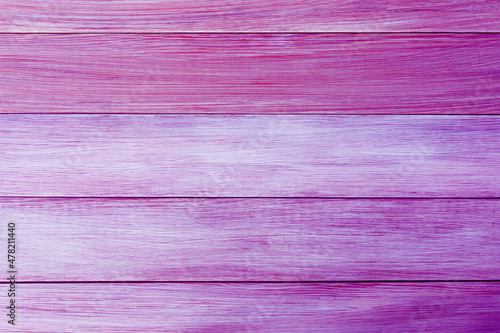 The background of wooden boards painted in the new trend colors of 2022 year Pacific Pink and Very Peri.
