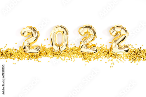 Happy New Year 2022. Foil gold balloons in form of numbers 2022. New year celebration. Gold Air Balloons on white background. Flat lay, top view, copy space