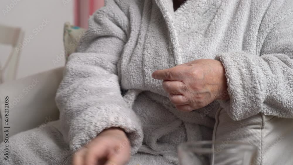 Female elderly sugar diabetic patient measuring blood glucose level with a glucometer at home. Health care, diabetic lifestyle. Close-up. Tracking shot. Female elderly sugar diabetic patient measuring blood glucose level with a glucometer at home. Health care, diabetic lifestyle. Close-up. Tracking shot.