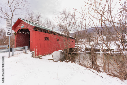 Arlington Covered bridge  a Vermont covered bridge spaning the Batten Kill river going to Rockwell's Retreat in the snow red painted siding, photo