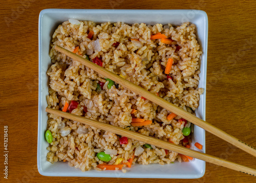 bowl of vegetable fried rice and chop sticks