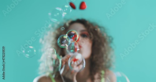 Girl blowing bubbles. photo