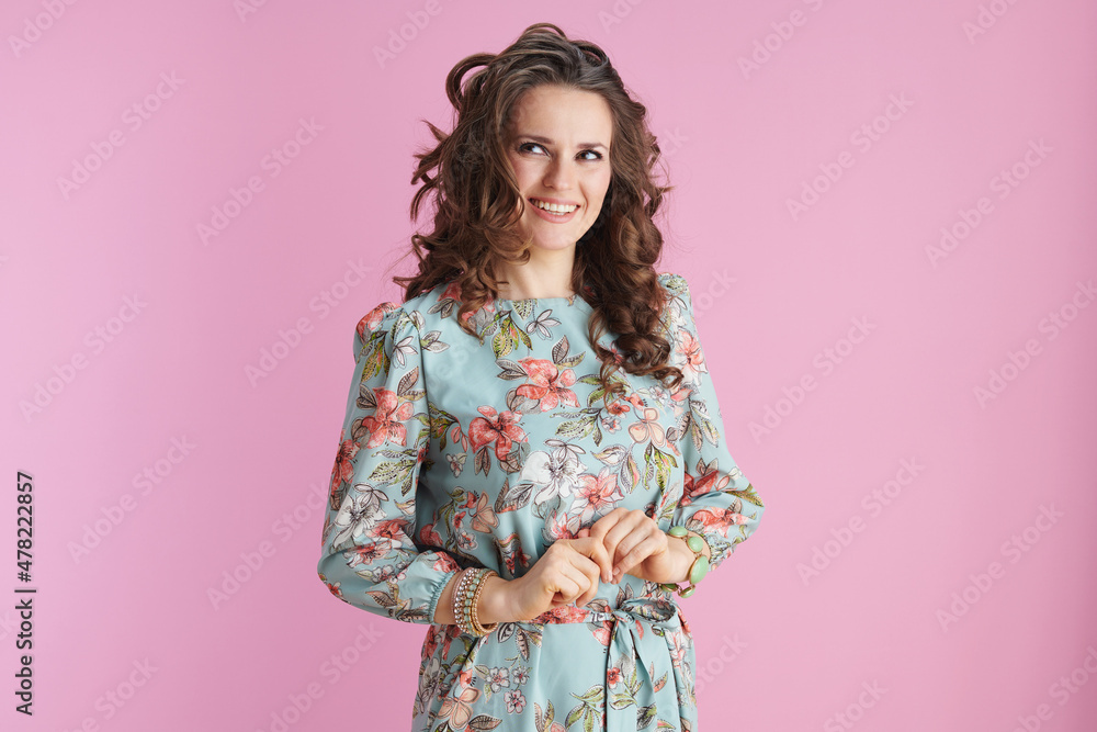 smiling elegant woman with long wavy brunette hair on pink smiling elegant woman with long wavy brunette hair on pink