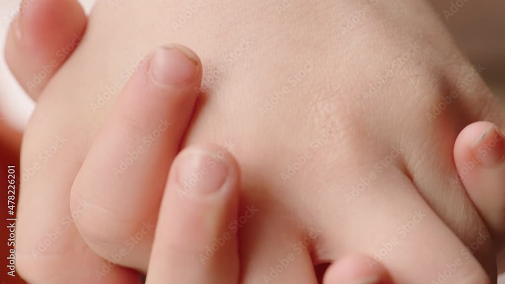 Close up of two children holding hands. Close up of two children holding hands.