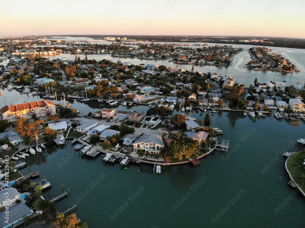 The aerial view of the residential area and waterfront homes during sunrise near Madeira Beach, Florida, U.S