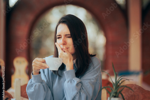 Woman Drinking Coffee Feeling Tooth Pain from Teeth Sensitivity 