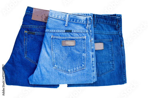 Jeans stack on a white background in store and supermarket.concept fashion dress jeans.image clipping paht.. photo