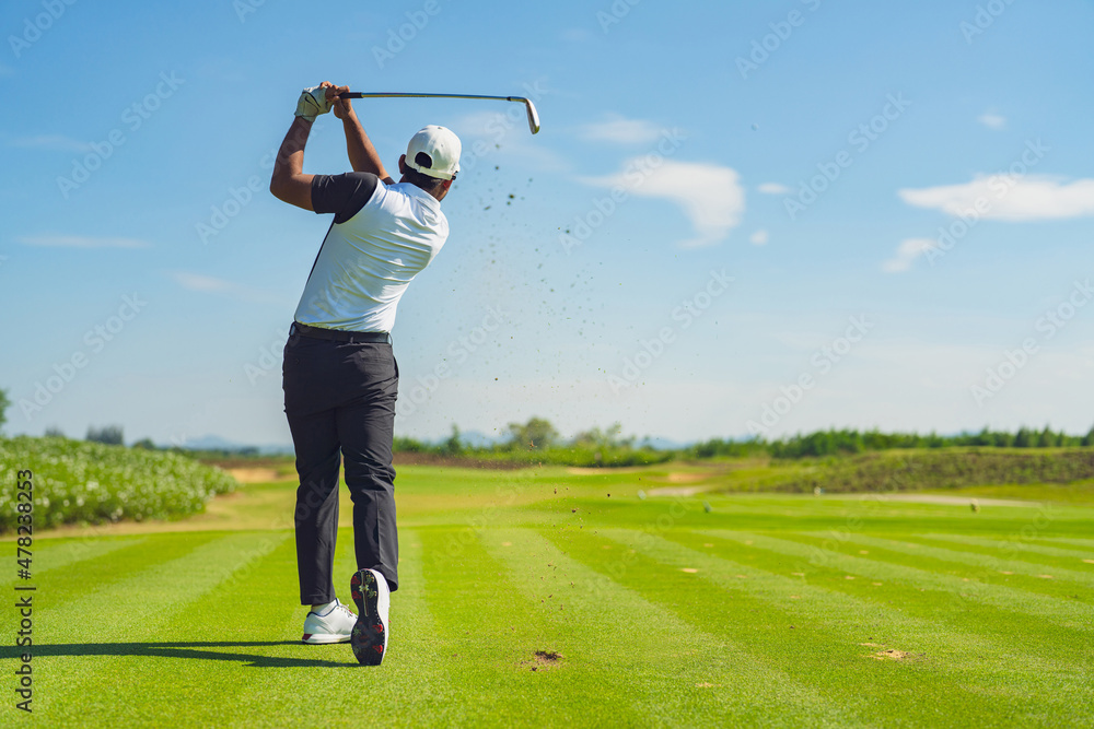 Asian man golfing on the course in summer - obrazy, fototapety, plakaty 