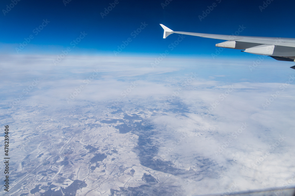 Airplane Window View Wing Over Snowy Landscape Airplane Window View Wing Over Snowy Landscape