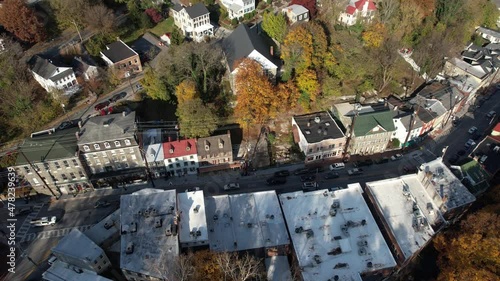 Aerial View of Idyllic Ellicott City, Historic Downtown, Main Street Traffic and Buildings on Sunny Autumn Day, Birdseye Drone Shot photo