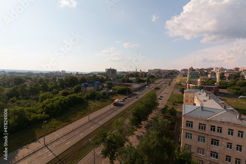 daytime city street in summer road with cars
