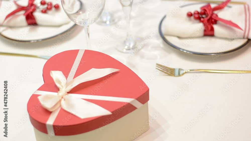 Giving heart shaped gift box for valentines day for february 14 Giving heart shaped gift box for valentines day for february 14