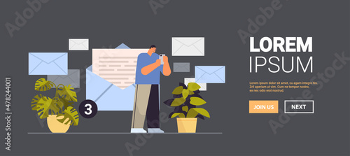 businessman sending or receiving letters on smartphone email inbox message notification new unread mail business communication