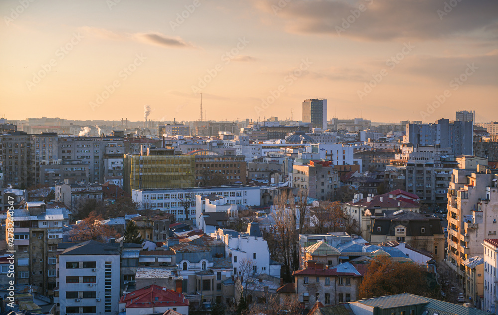 Bucharest from above during a beautiful winter sunset. View to city center, downtown and its most popular landmarks.