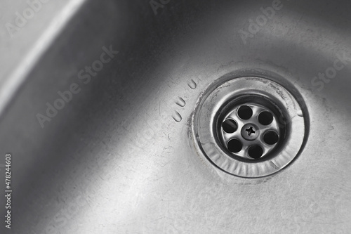 Fotografie, Obraz Water drop down on stainless steel kitchen sinkhole