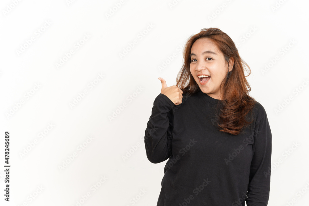 Showing and Pointing Aside with Thumb Of Beautiful Asian Woman Wearing Black Shirt Showing and Pointing Aside with Thumb Of Beautiful Asian Woman Wearing Black Shirt