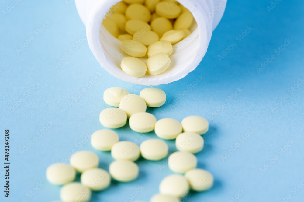 Medical pills and tablets spilling out of a drug bottle. Medical pills and tablets spilling out of a drug bottle.