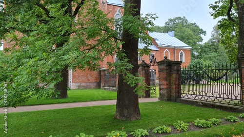 Old castle gate before park. Old brick house photo