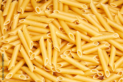 Background of raw macaroni, pasta. Italian food