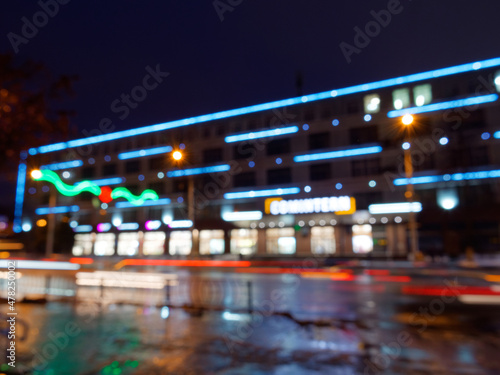 Gomel, Belarus - December 30, 2021: street illumination in the evening with heavy traffic