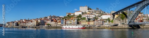 Panorama of the old town of Porto with the river Douro and the famous iron bridge © elxeneize