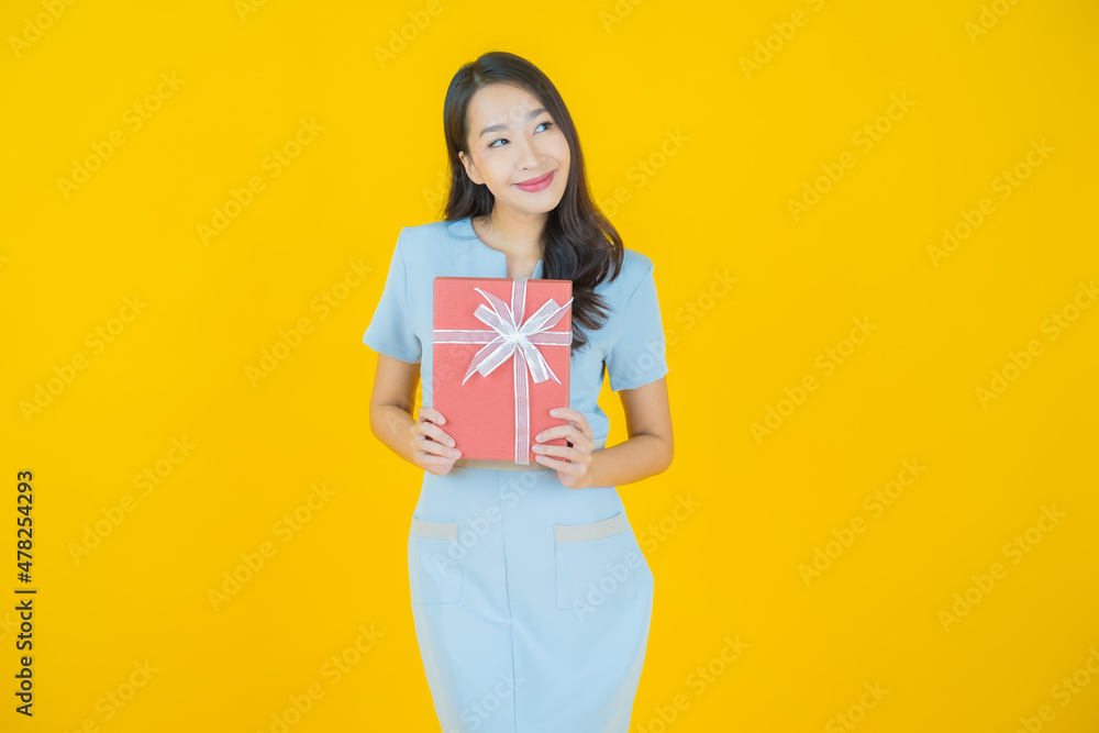 Portrait beautiful young asian woman smile with red gift box Portrait beautiful young asian woman smile with red gift box
